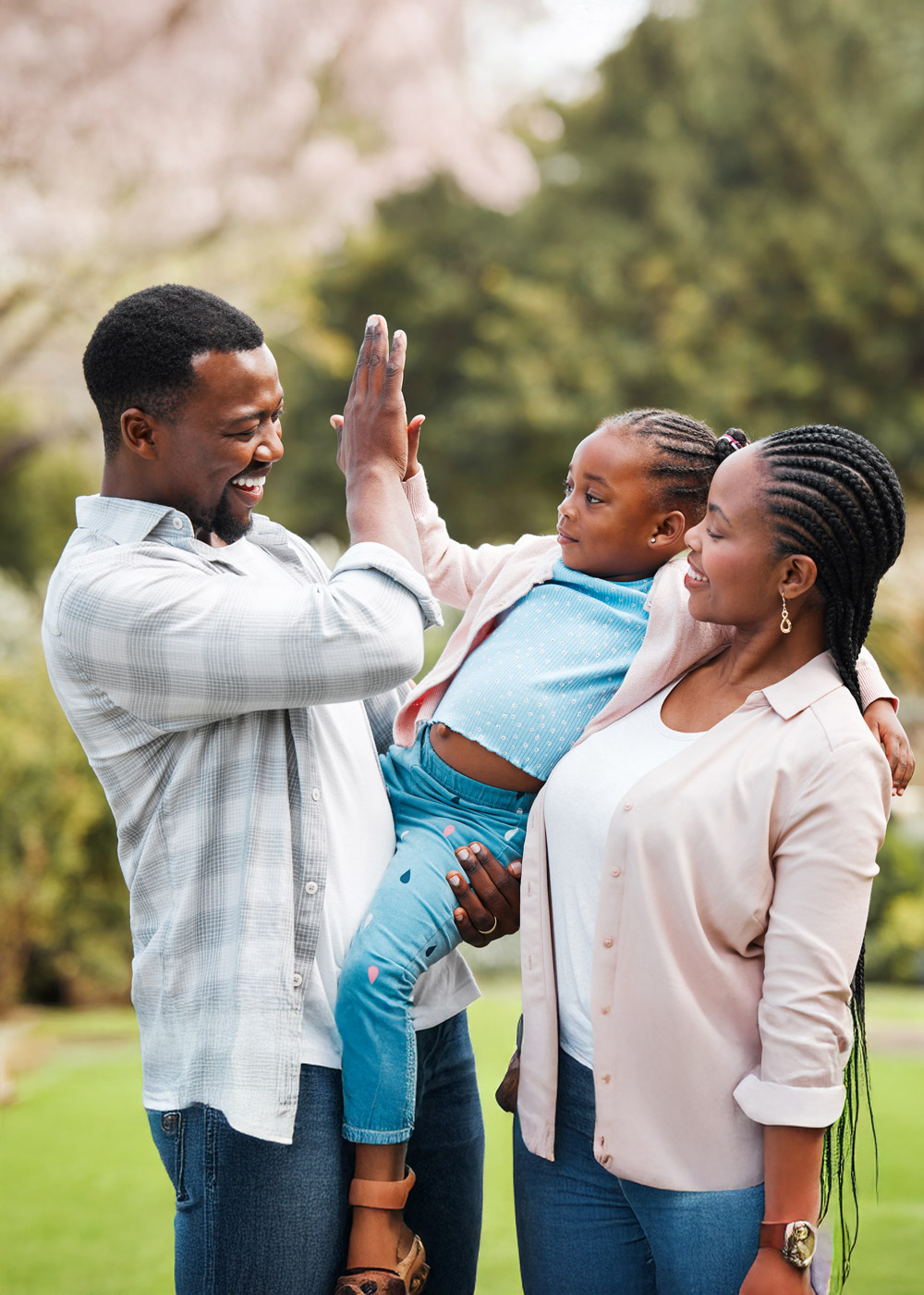 Young Father High Fiving Daughter